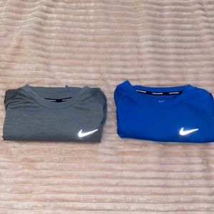 A bundle of Nike breathable running shirts Size: L